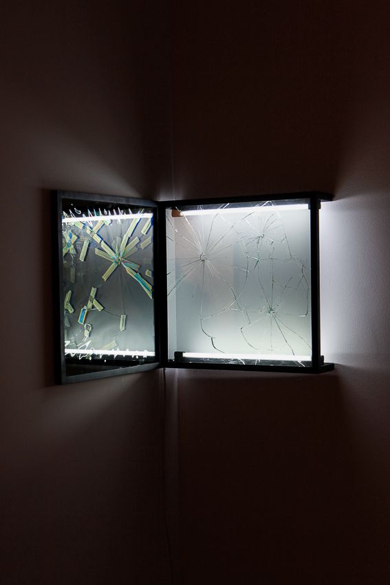 Pablo Rasgado. Afterimage (Repaired Broken Mirror #4), 2014. Welded steel, mirror, filters and fluorescent light, 19 1/2 x 19 1/2 inches