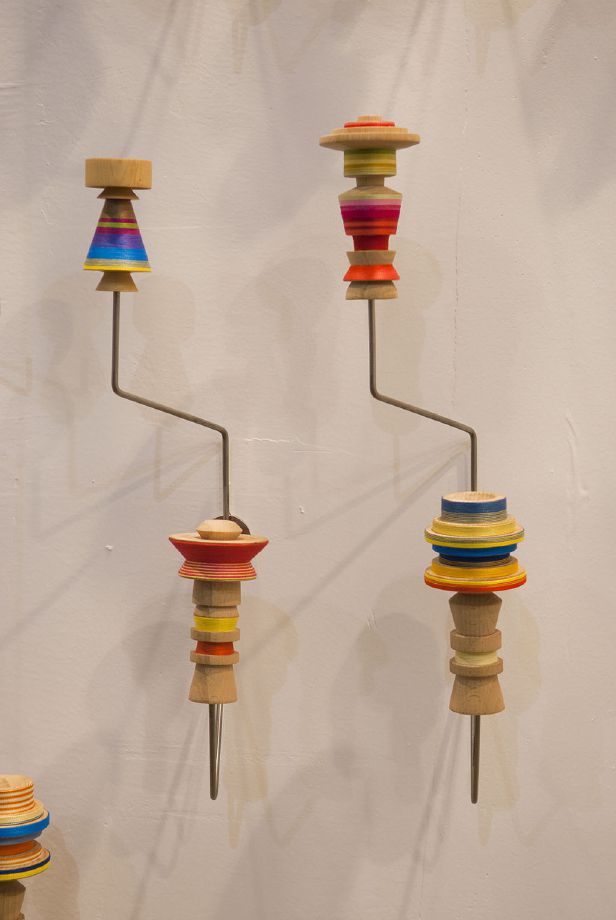 Edgar Orlaineta. Hang-them-all, 2014 Stainless steel, turned wood and color thread Dimensions variable (60 racks with 120 Katsinas) (detail)
