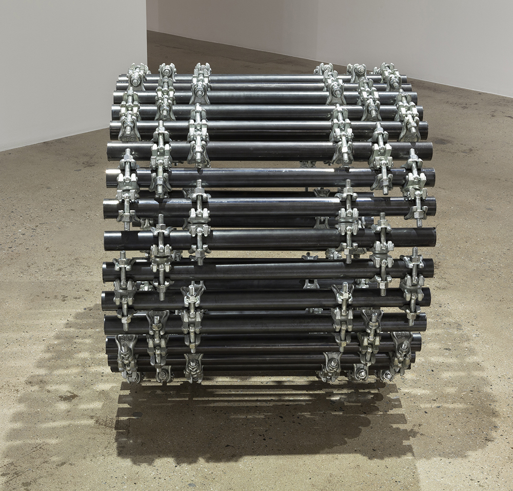 luciana lamothe, sculpture, women sculptor, installation, free function, form over function, tension, plywood, iron pipes, couplers,