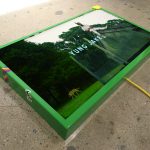 <em>off top</em>, 2017. Digital video, monitor, spray paint, Model Magic ®, sticker and ink on powder coated steel and extension cord, Length: 3 minutes, 2 seconds, 27 x 45 x 4 inches