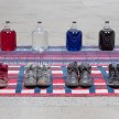 Amanda Ross-Ho and Diedrick Brackens. <em>Untitled Floor Arrangement (300 bucks would save my life)</em>, 2017. Handwoven cotton rugs, glass jugs, Procion dyes, Nike Dunks, and Reebok Pumps, 12 1/4 x 64 1/2 x 48 inches thumbnail
