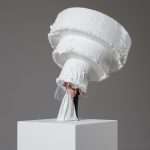 Addie Wagenknecht. <em>Waiting for Mr. Right</em>, 2017. Polystyrene, silicone, alabaster, drip candles and artificial flowers, 47 x 12 1/2 x 11 inches