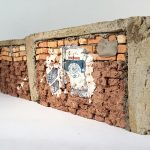 Ximena Garrido-Lecca. <em>Paredes de Progreso: Andino / Walls of Progress: Andean</em>, 2013. Mud, straw, cement, fired bricks and acrylic, 6 5/16 x 19 1/2 x 1 9/16 inches