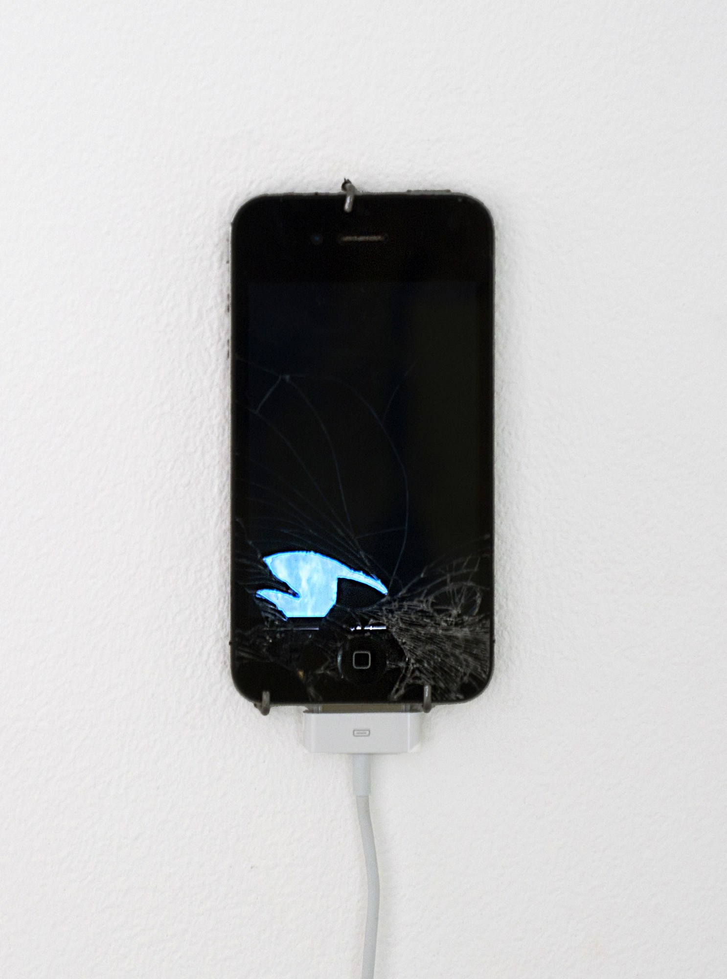 <em>Return of the Broken Screens (Apple iPhone 4)</em>, 2015.  Broken found smart phone, video, 4 3/4 x 2 1/4 inches