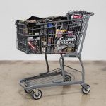 Adriana Martinez. <em>CMYK</em>, 2017. Metal shopping carts, plastic, spray paint and packed groceries, 41 x 25 x 32 inches (104.1 x 63.5 x 81.3 cm)
