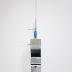 Mariana Murcia. <em>Save As 2</em>, 2017. Clamp, granite, marble aluminum plexiglass cases and Iphone 5s, 24 x 5 x 5 inches (61 x 12.7 x 12.7 cm)