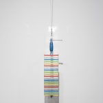 Mariana Murcia. <em>Save As 1</em>, 2017. Clamp, iPhone 5c cases and mirrors, 24 x 5 x 6 inches (61 x 12.7 x 15.2 cm)