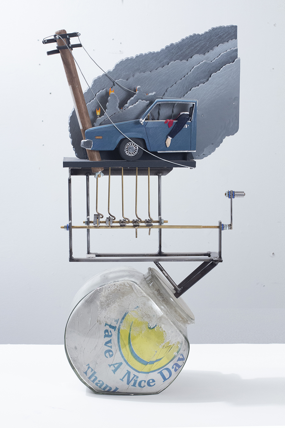 Nick Doyle. <em>Executive Toy: Crash and Burn</em>, 2019. Concrete, cookie jar, bodega bag, steel, plywood, denim, wire, brass, flashe, paper, cotton, sand paper, steel wire and hardware, 30 x 16 x 8 inches (76.2 x 40.6 x 20.3 cm)