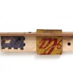 Kevin McNamee-Tweed.<em> Lorca Shelf</em>, 2019. Ink on wood with affixed found wood, 3 x 11 x 1 1/4 inches (7.6 x 27.9 x 3.2 cm)