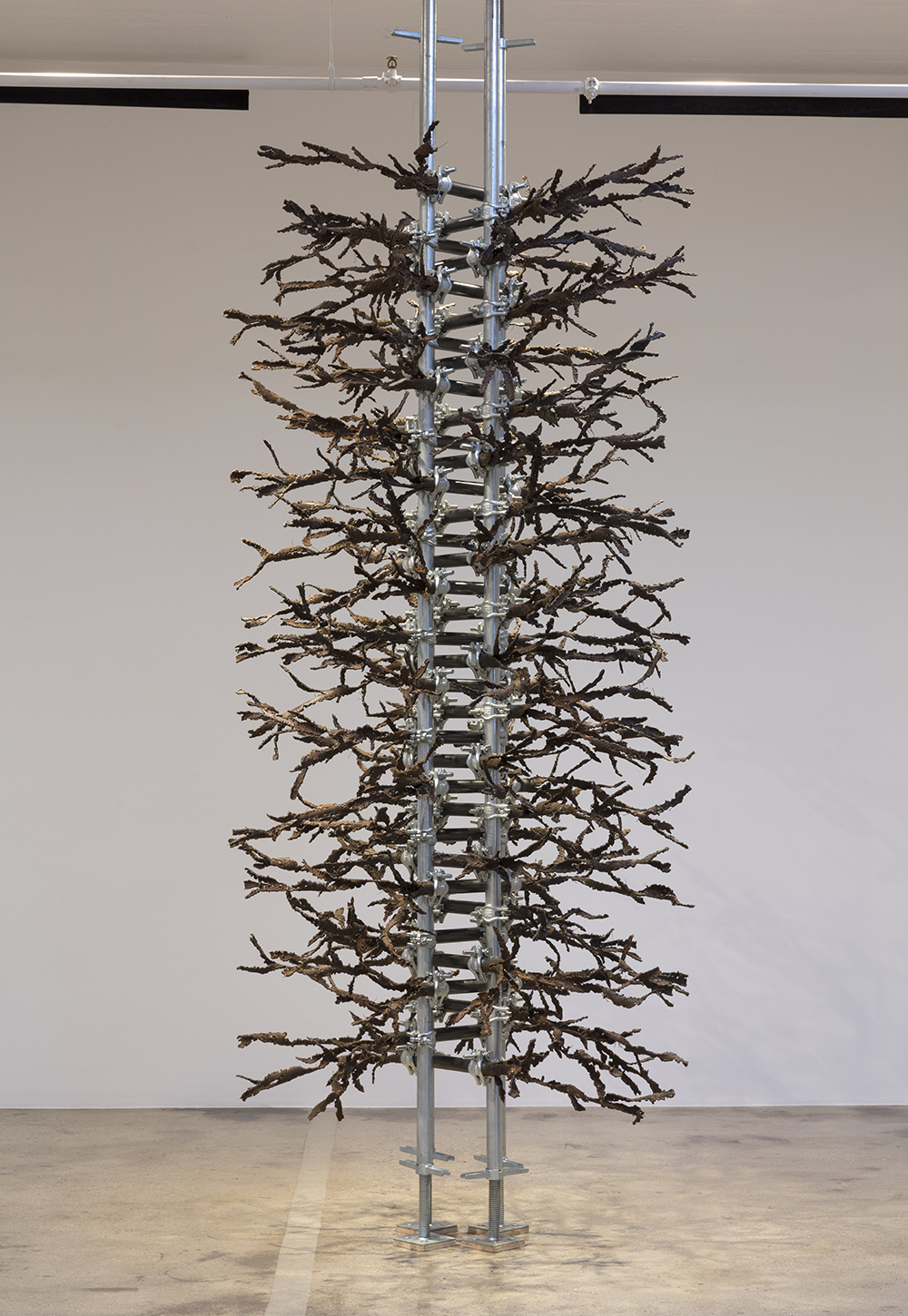Luciana Lamothe. <em> Straight Burn, 2</em>, 2019. Iron pipes and clamps, 132 x 60 x 60 inches (335.3 x 152.4 x 152.4 cm)