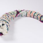Hannah Epstein. <em>Soft Worm</em>, 2019. Wool, acrylic, burlap, polyfill and found toy parts, 7 x 6 x 56 inches (17.8 x 15.2 x 142.2 cm)