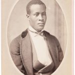 Studio portrait of young African American man. Edward Fraas & Co.: [Bridgetown, Barbados], n.d., ca 1880.