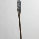 Jarrett Key. <em>Hot Comb No. 3 “Snaggle Tooth”</em>, 2020. Black forged steel with bronze burnishing, 29 1/2 x 2 1/2 x 2 inches (74.9 x 6.4 x 5.1 cm)