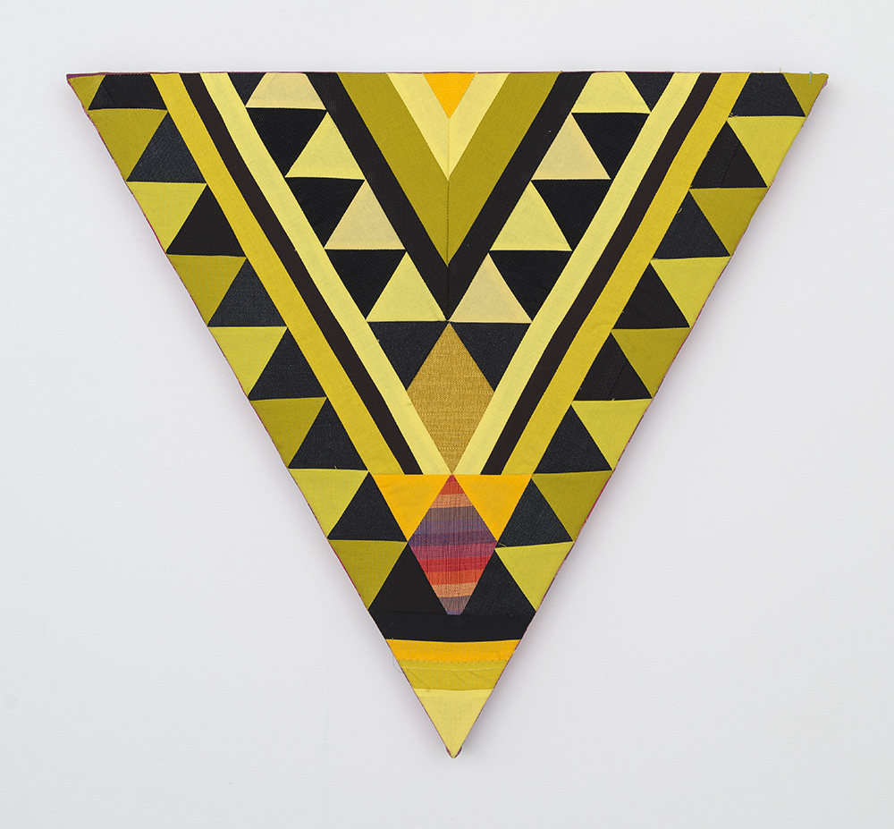 Paolo Arao. <em>Armor</em>, 2020. Sewn cotton, denim, corduroy, canvas and handwoven fibers on shaped wood support, 19 3/4 x 22 inches (50.2 x 55.9 cm)