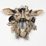 Jakob Rowlinson. <em>Mask VIII (Endymion Turned)</em>, 2023. Punched leather, buckles, rings, studs, eyelets and trimmings, 12 x 15 x 3 7/8 inches (30.5 x 38.1 x 9.8 cm)