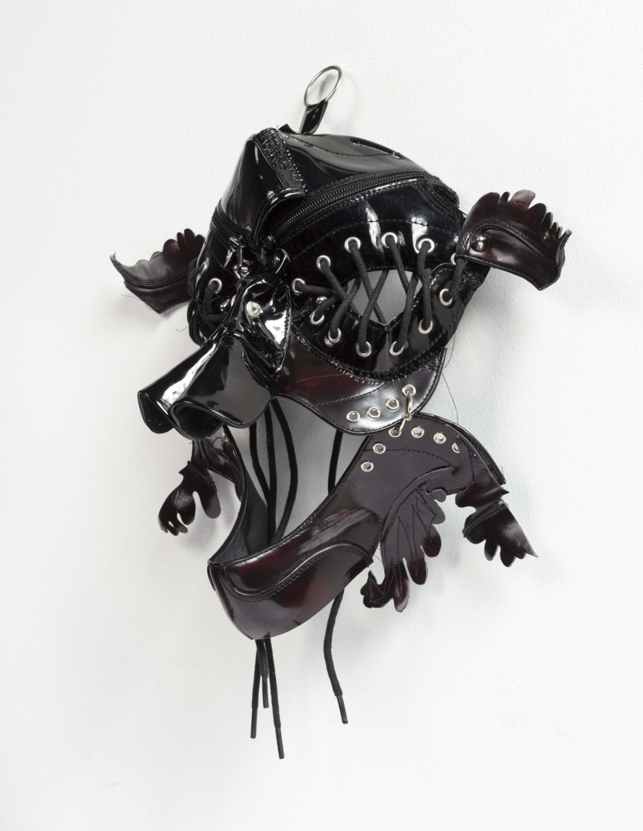 Jakob Rowlinson. <em>Mask XII (Appellant Fawn)</em>, 2023. Patent leather, shoelaces, eyelets, split pins and clip rings, 12 x 15 x 6 3/4 inches (30.5 x 38.1 x 17.1 cm)