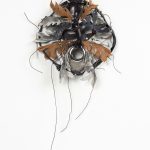Jakob Rowlinson. <em>Mask XV</em>, 2023. Leather, boot zip, waxed cotton thread, leather shoes, spiked screws, large nickel eyelet, split pins, rivets and sea glass, 12 1/4 x 9 x 2 3/4 inches (31 x 23 x 7 cm)