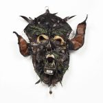 Jakob Rowlinson. <em>Mask XVI (Taurus)</em>, 2023. Leather boots, viscose shoes, cotton embroidery, boot buckle, rings, waxed cotton thread, split pins, canvas All-stars shoes, rivets, safety pins, rings, goat’s tooth, sweet gum ball, piercings and screws, 27 x 23 x 5 1/2 inches (68.6 x 58.4 x 14 cm)