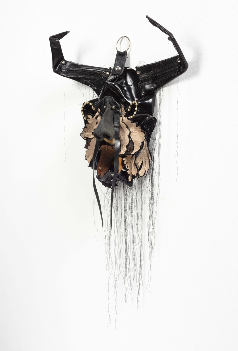 Jakob Rowlinson. <em>Mask XIV</em>, 2023. Leather boots, zips, faux pearl necklace, faux leather, clip rings, screws and cotton thread, 23 x 18 x 4 3/4 inches (58.4 x 45.7 x 12.1 cm)